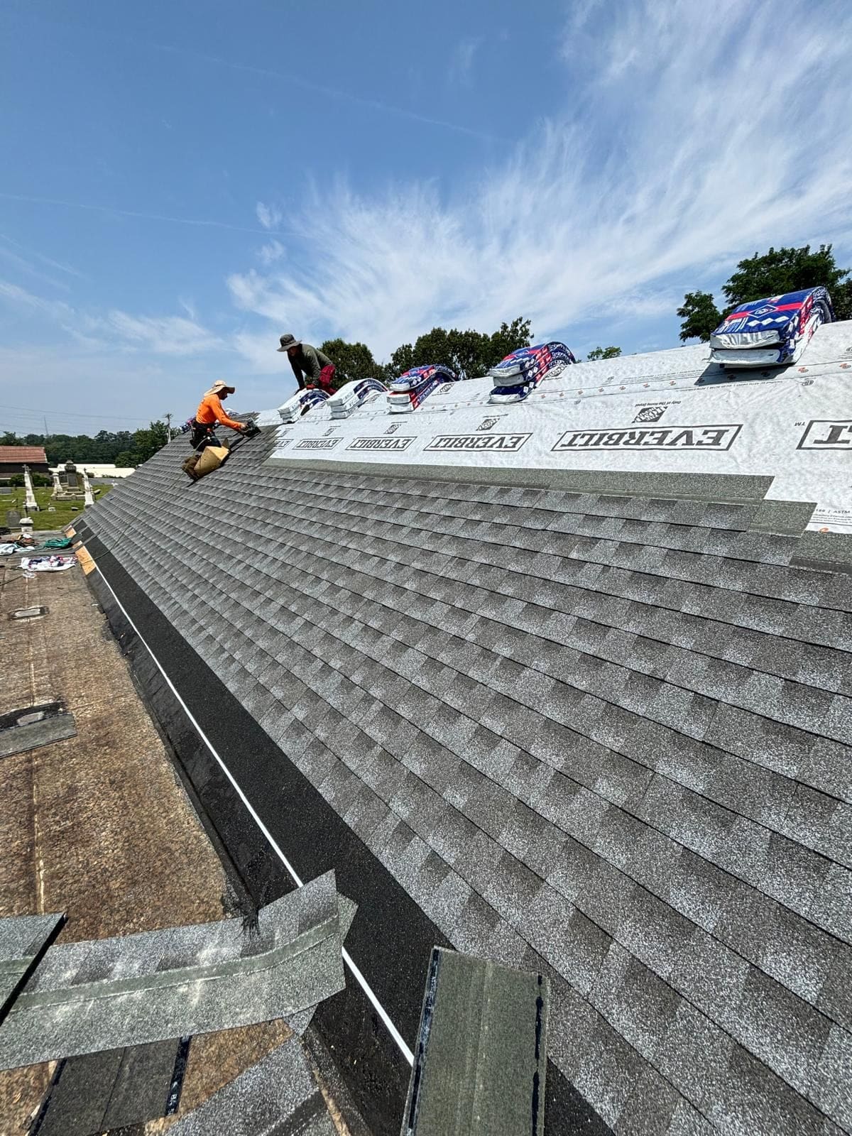 New architectural asphalt shingles being installed course by course