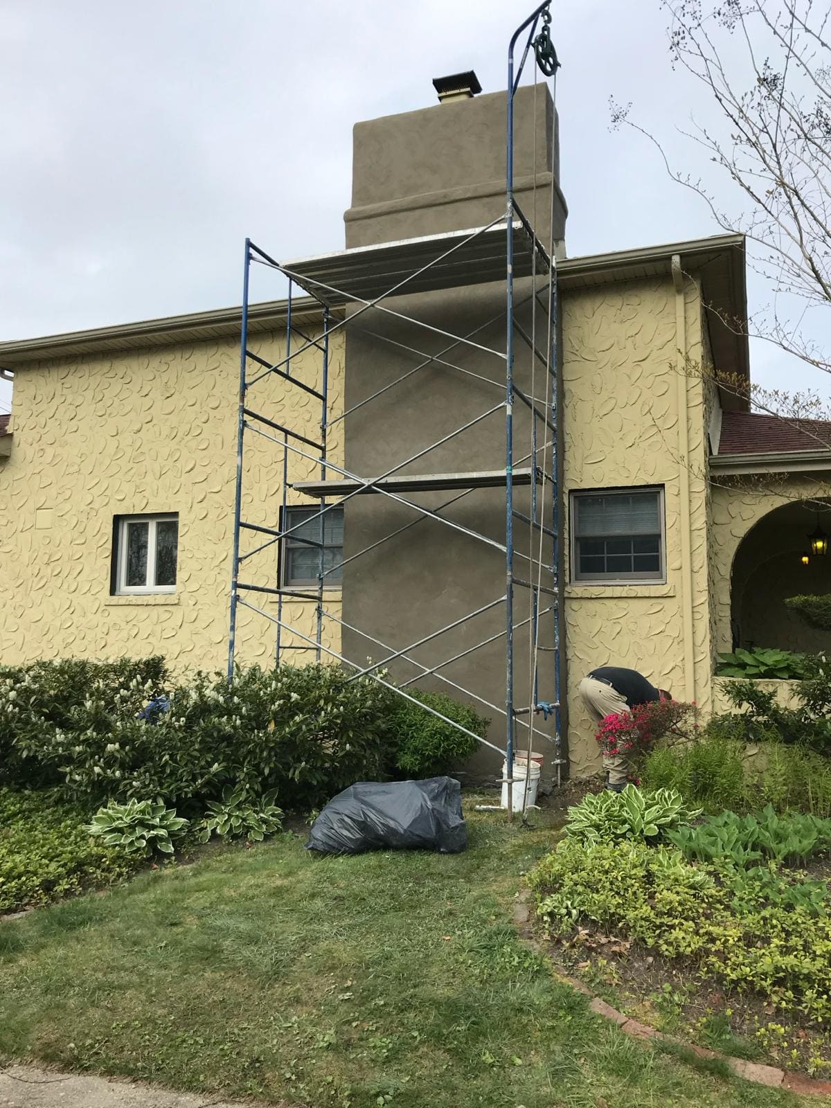 Chimney exterior resurfaced with a new stucco coat by Asset Roofing & Chimney