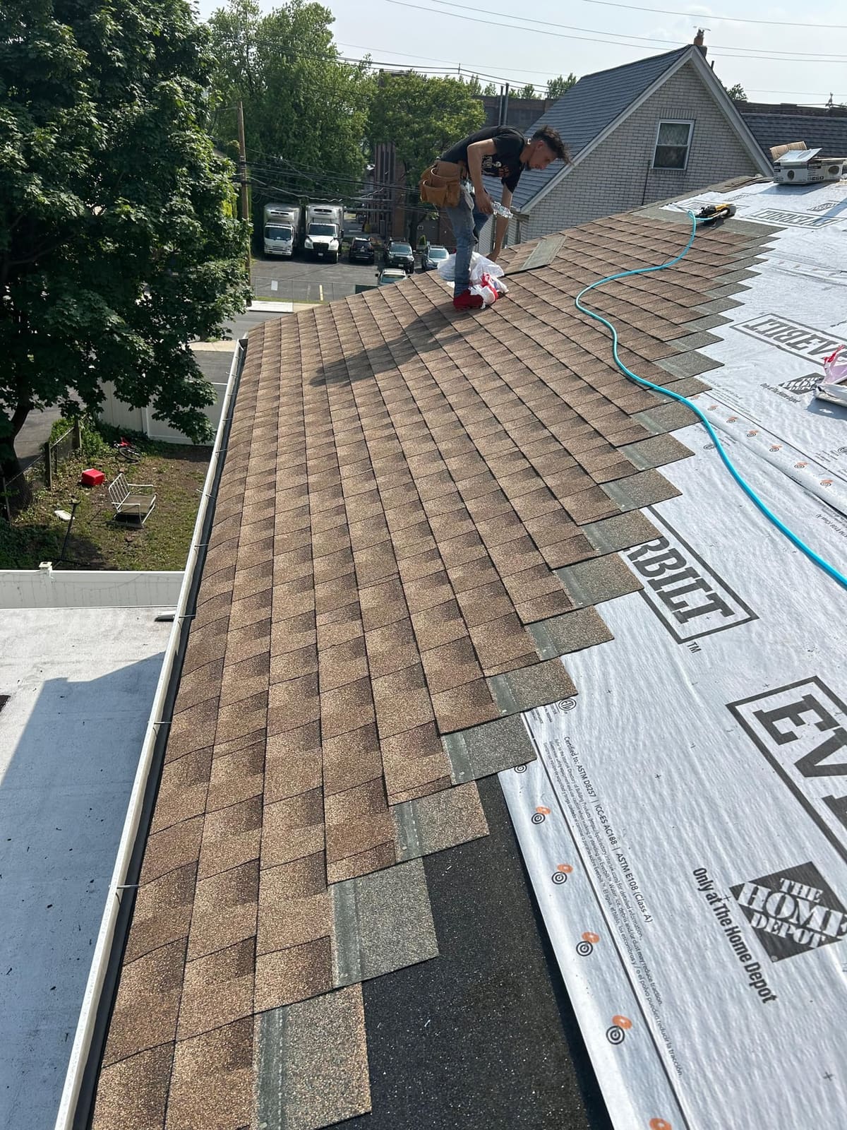 Starter course and first shingles installed at the eave over ice-and-water barrier