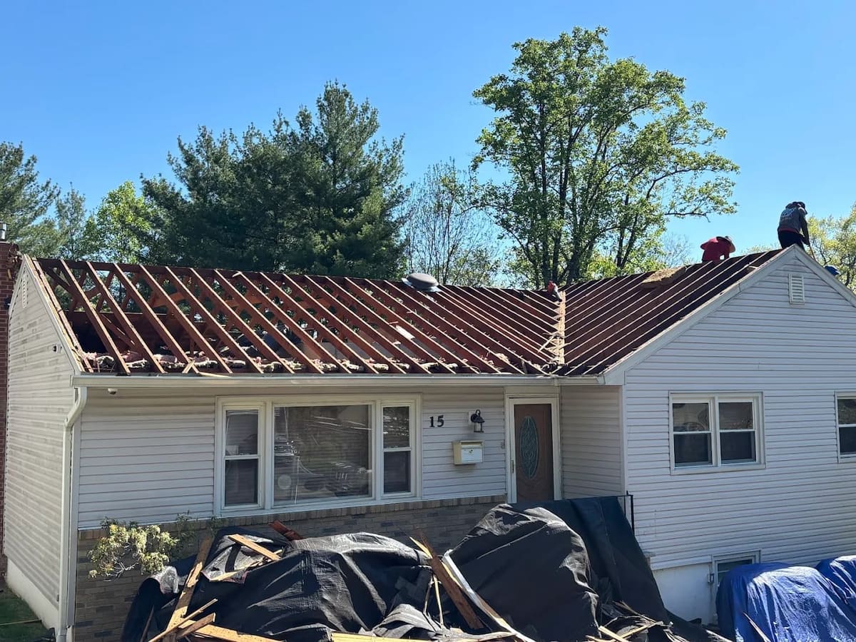 Roof stripped to the deck after shingle damage, ready for new underlayment